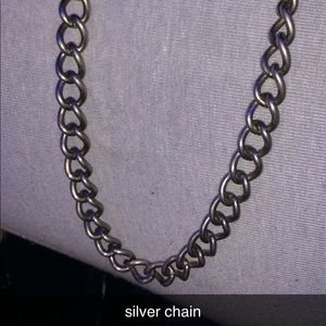 silver chain and black leaf necklace
